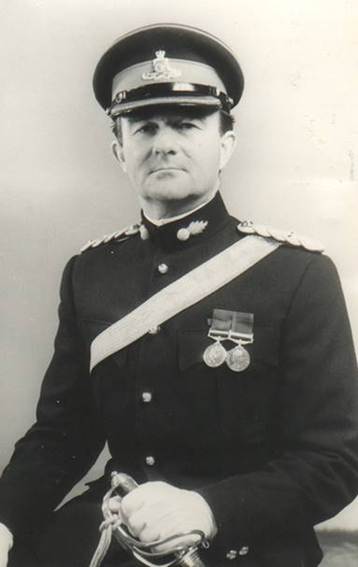 A person in a uniform

Description automatically generated with medium confidence