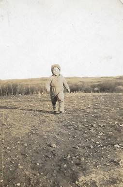 A person standing in a field

Description automatically generated with low confidence