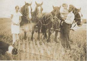 A group of people standing next to horses

Description automatically generated with low confidence