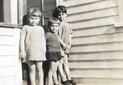 A group of children standing outside a building

Description automatically generated with low confidence