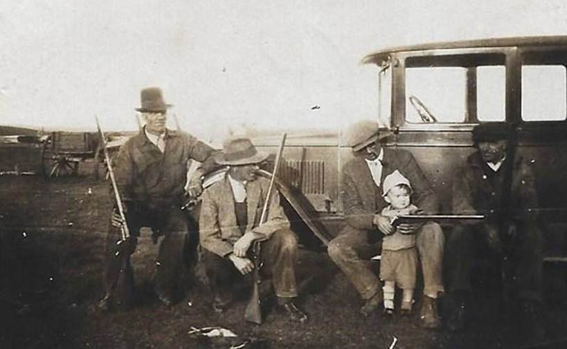 A picture containing old, black, group, posing

Description automatically generated