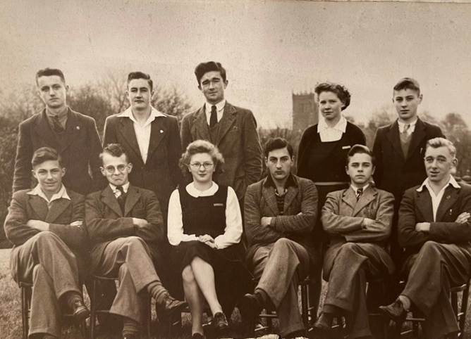 A group of people posing for a photo

Description automatically generated