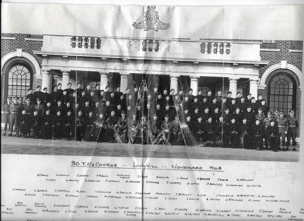 A group of people standing in front of a building

Description automatically generated with low confidence