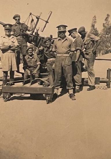A picture containing text, military vehicle, old, outdoor

Description automatically generated