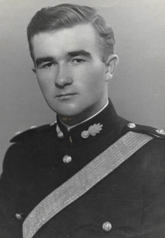 A vintage photo of a person in a suit and tie

Description automatically generated