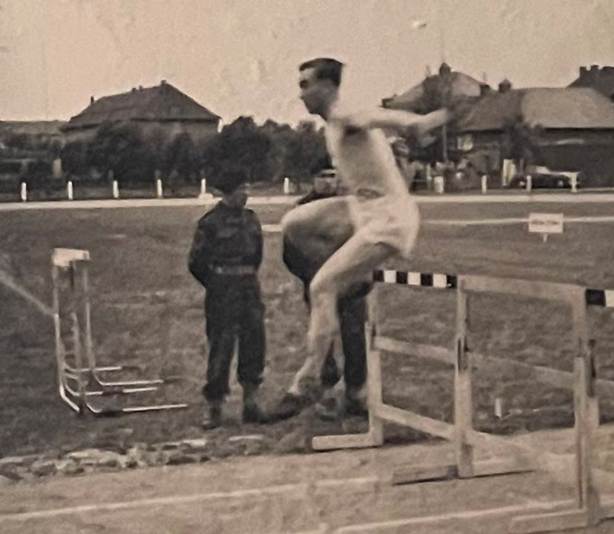 A person jumping over a bar

Description automatically generated with medium confidence