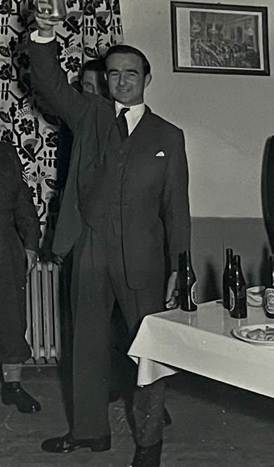 A person in a suit

Description automatically generated with low confidence