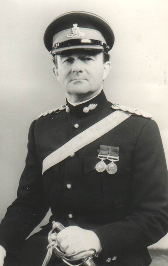A person in a uniform

Description automatically generated with medium confidence