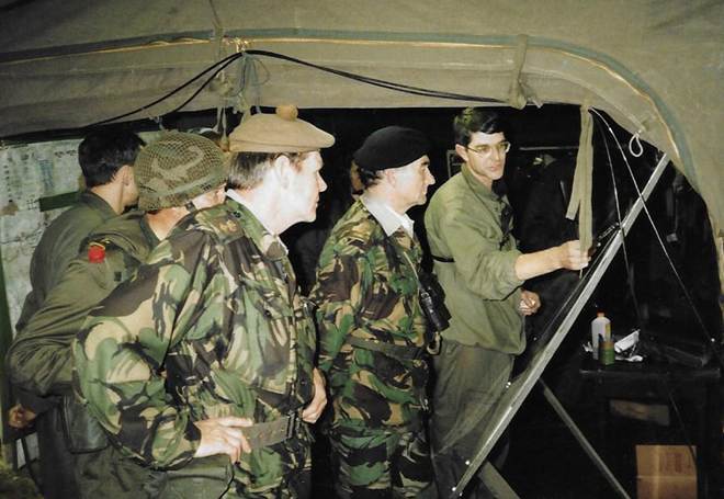 A group of soldiers in a tent

Description automatically generated with low confidence