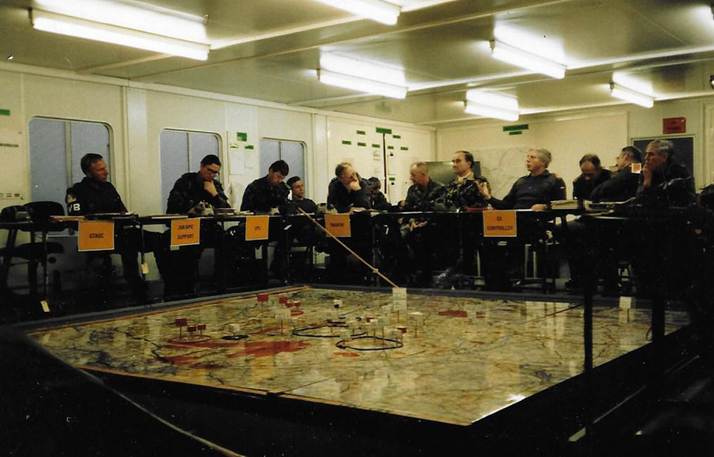 A picture containing indoor, ceiling, working, table

Description automatically generated