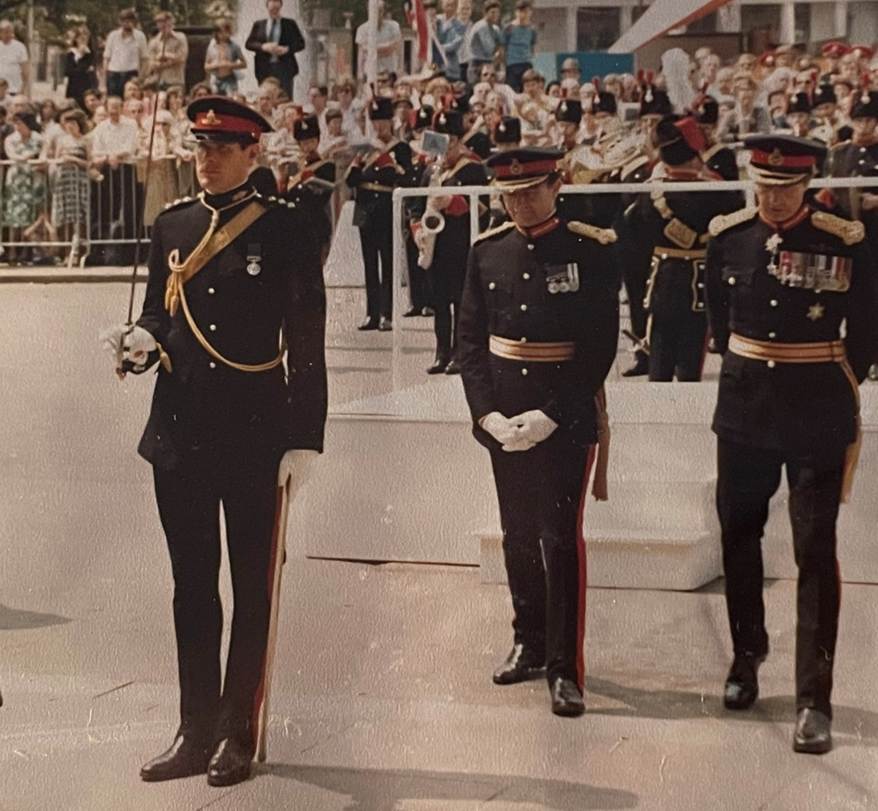 A picture containing person, outdoor, ground, military uniform

Description automatically generated