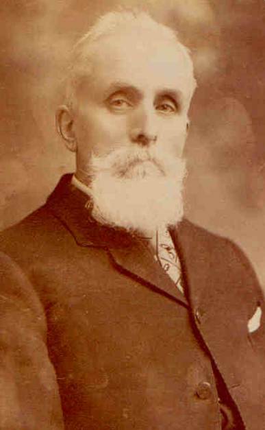 A person with a white beard

Description automatically generated