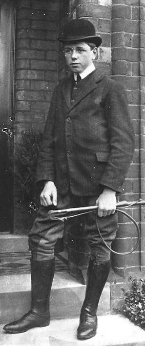 A vintage photo of a person in a suit and tie

Description automatically generated