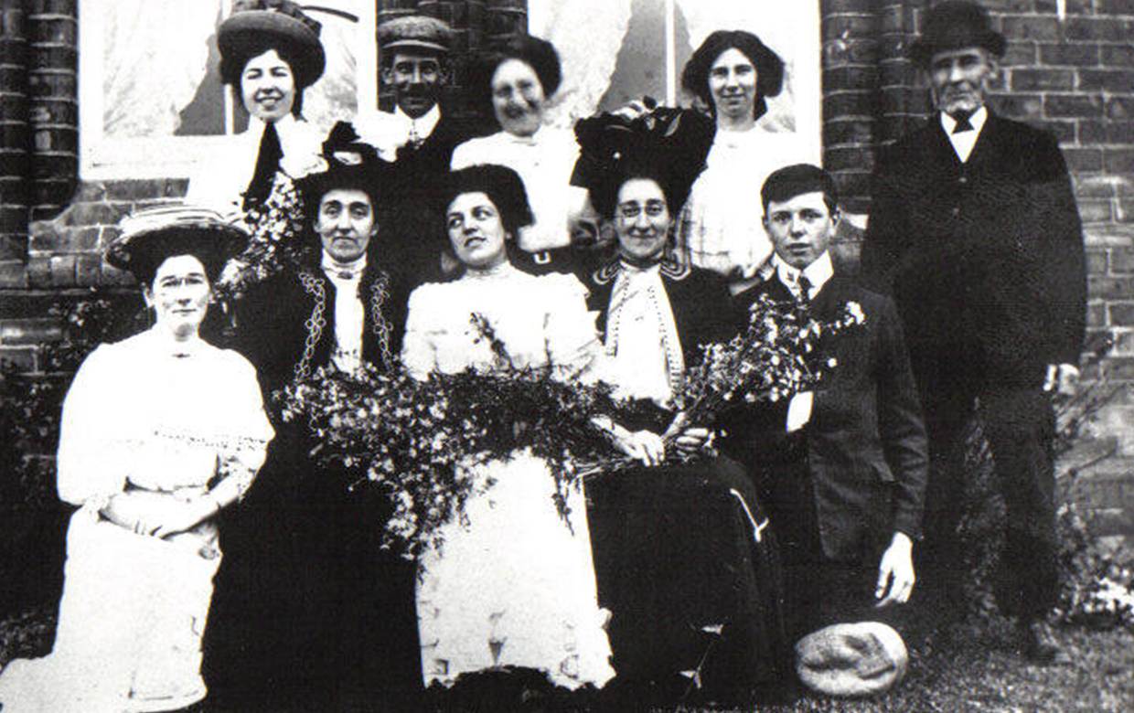 A group of people posing for a photo

Description automatically generated