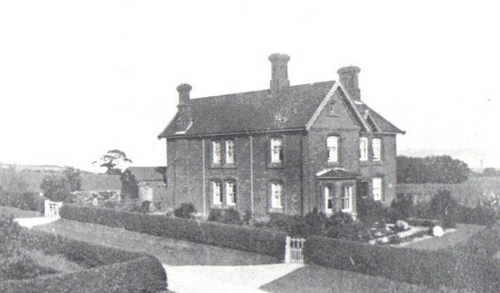 A black and white photo of a house and some trees

Description automatically generated with low confidence