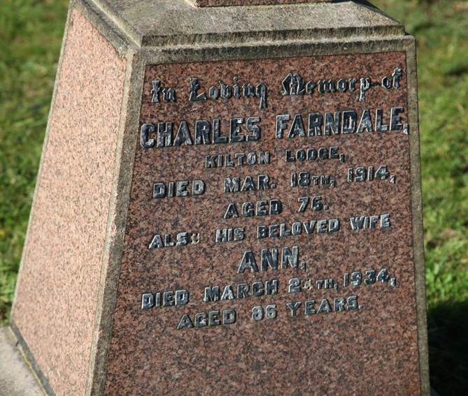 A tombstone with writing on it

Description automatically generated with low confidence