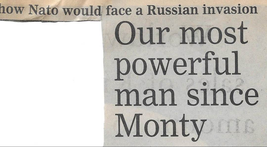 A newspaper with a black and white text
Description automatically generated