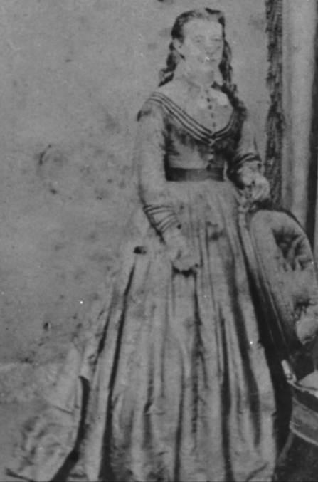A person in a dress

Description automatically generated