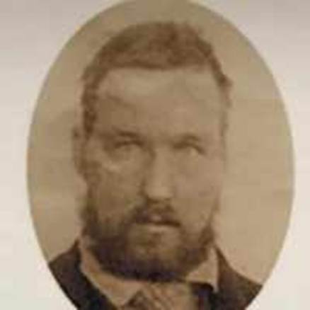 A person with a beard

Description automatically generated