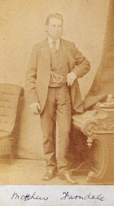 A person standing in front of a chair
Description automatically generated