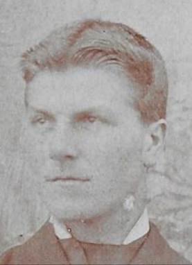 A close up of a mans face

Description automatically generated