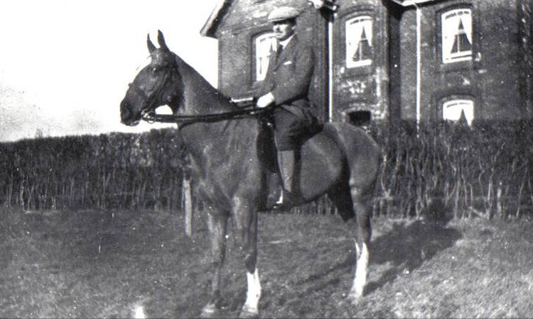A person riding a horse

Description automatically generated