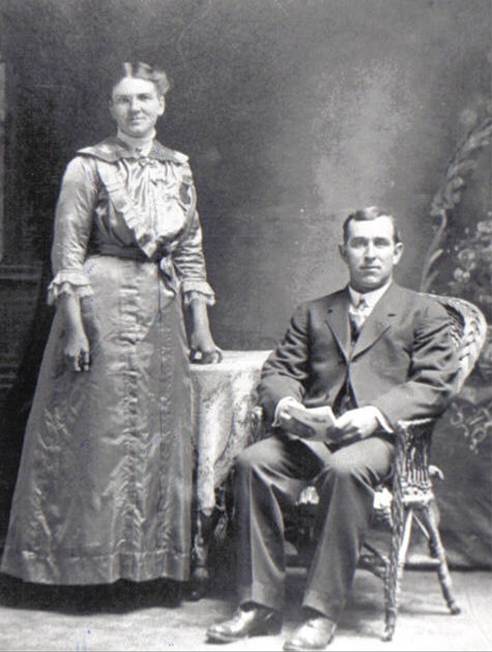A person and person posing for a picture
Description automatically generated
