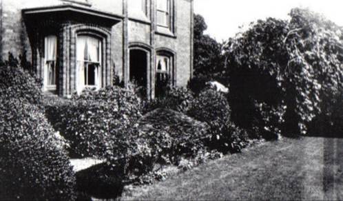 A black and white photo of a house and some trees

Description automatically generated with low confidence