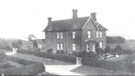 A black and white photo of a house and some trees
Description automatically generated with low confidence