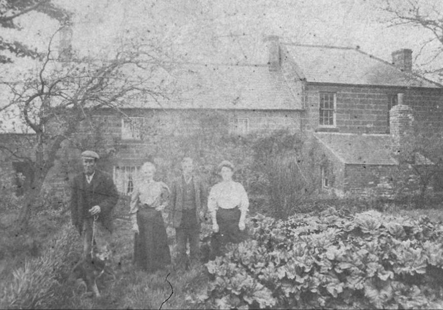 An old photo of a person
Description automatically generated
