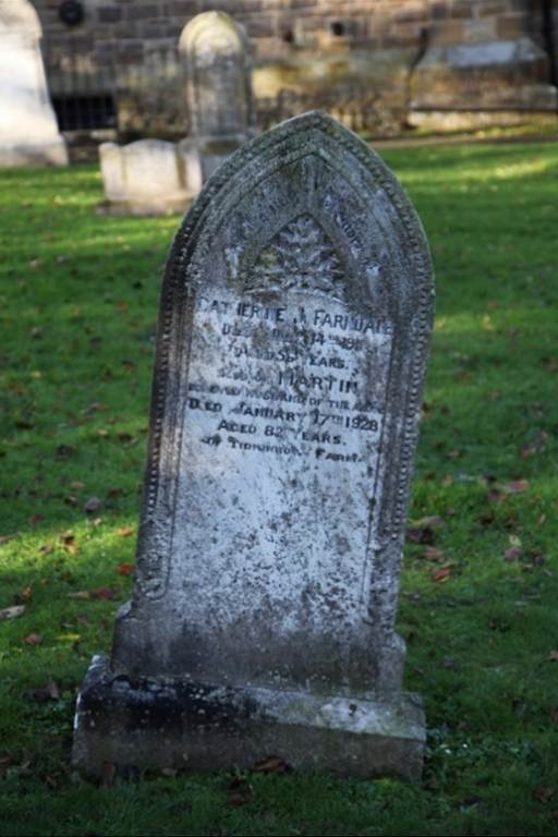 A close-up of a tombstone

Description automatically generated