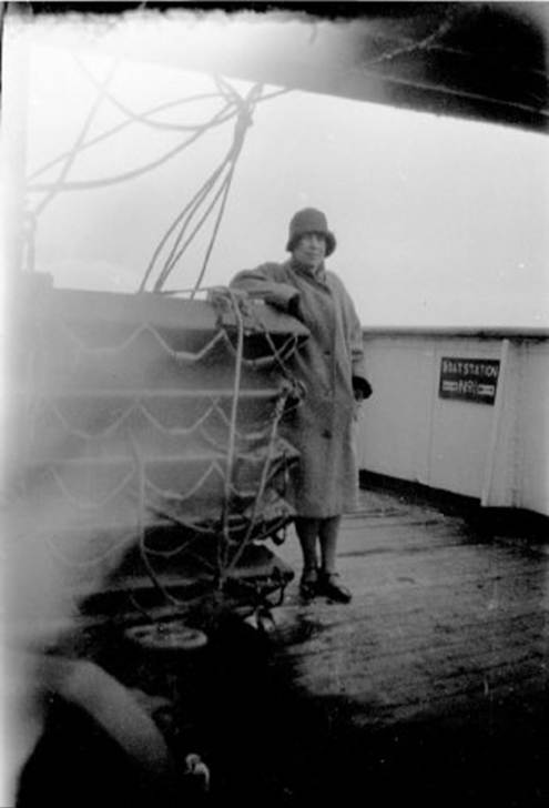 A person standing on a deck of a ship
Description automatically generated