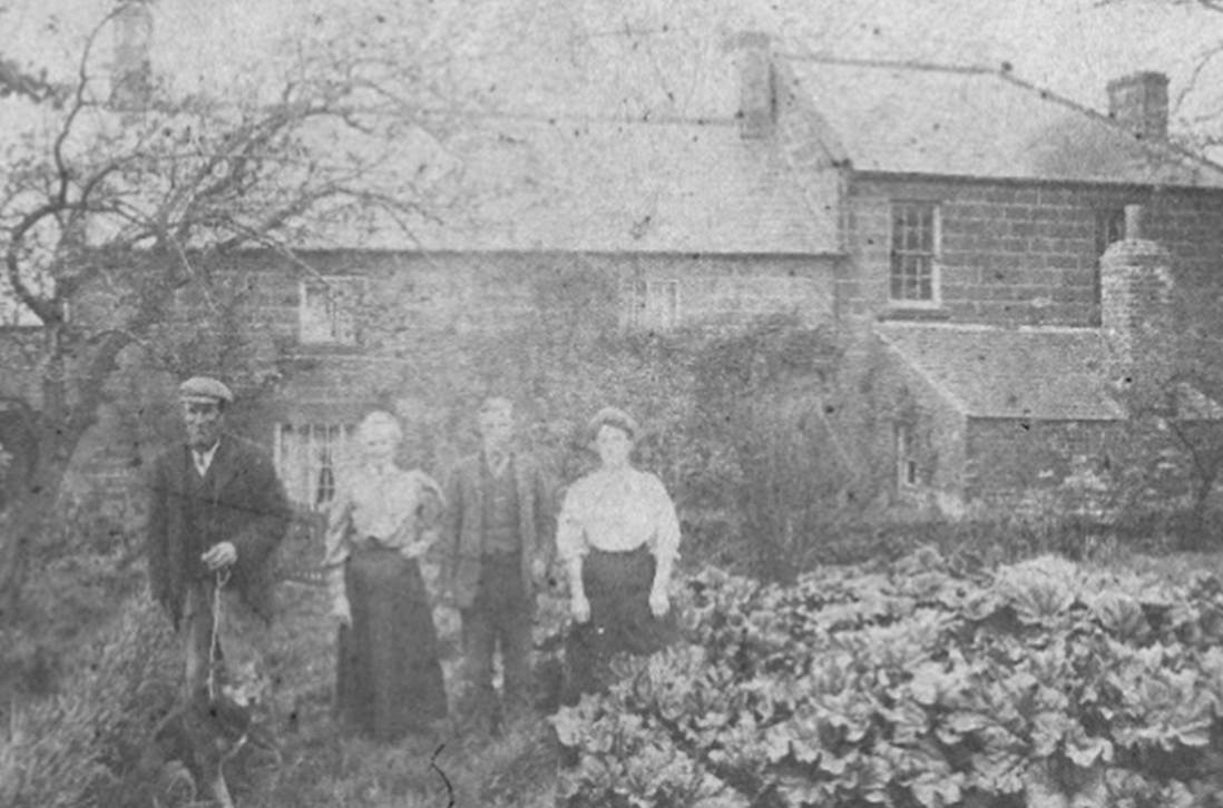 An old photo of a person
Description automatically generated