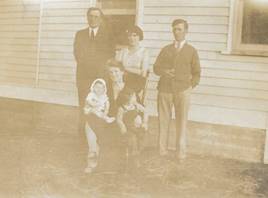 A group of people posing for a photo
Description automatically generated with medium confidence
