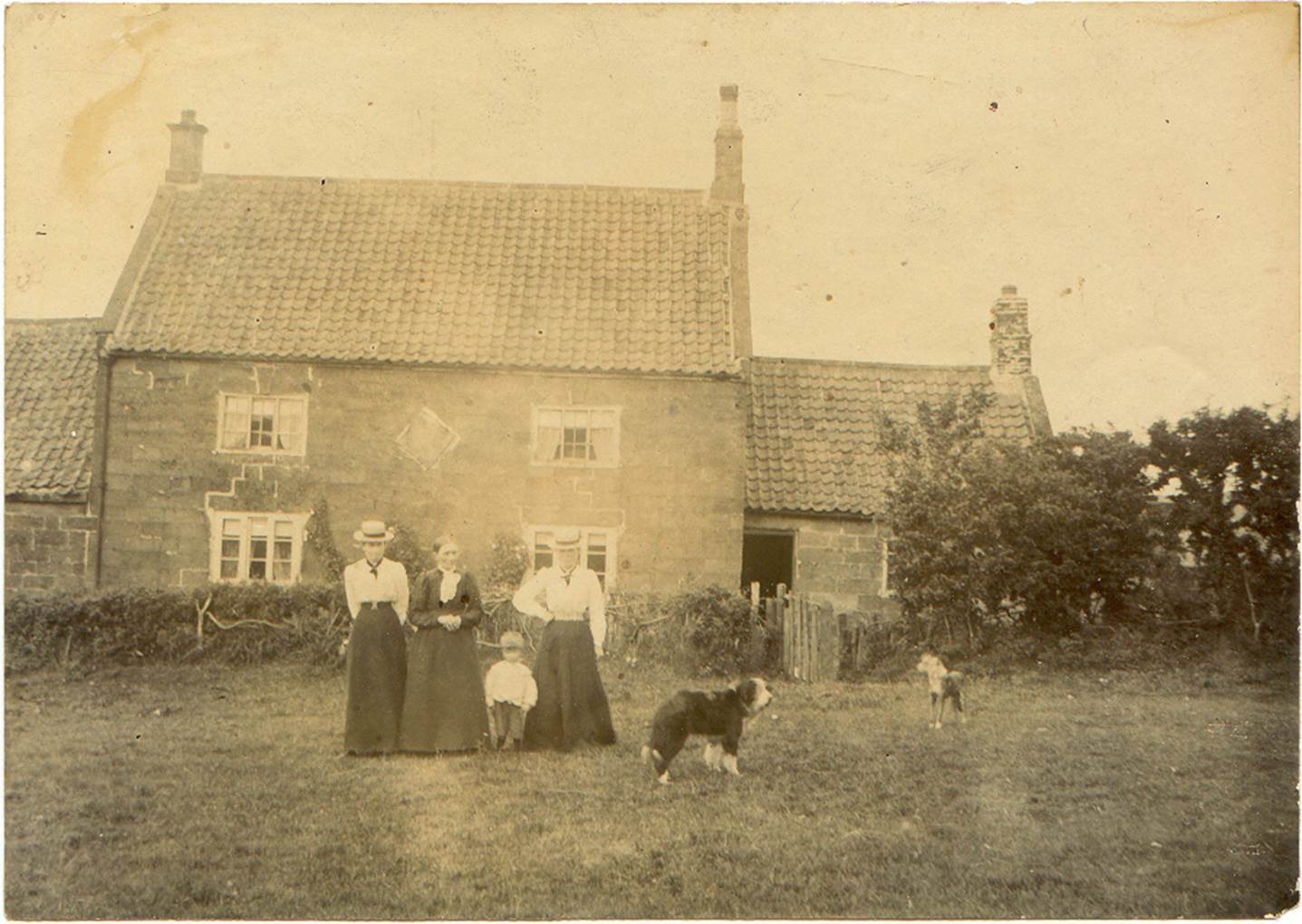A family standing in front of a house
AI-generated content may be incorrect.