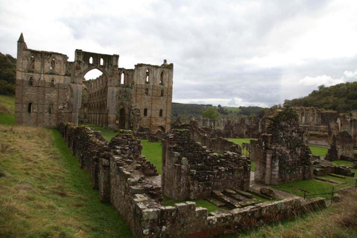A stone ruins of an old building
Description automatically generated