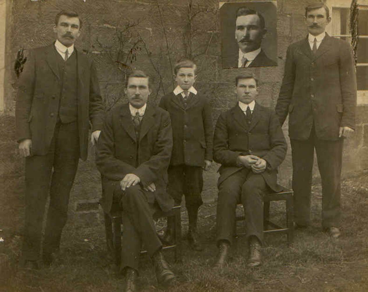 A group of men in suits
Description automatically generated